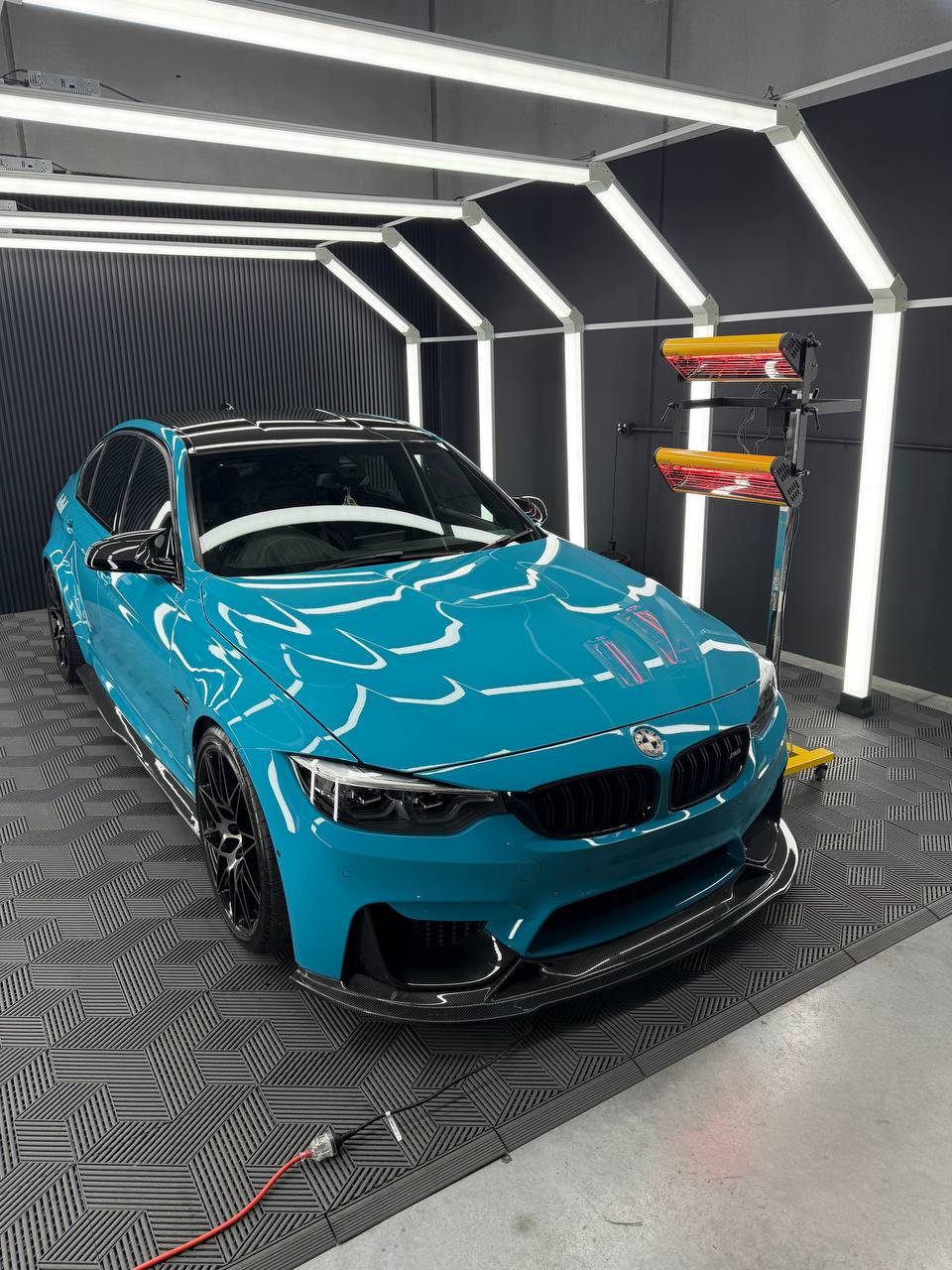 Deep gloss finish after GYEON ceramic coating on a blue BMW M-car at Speca Detailing