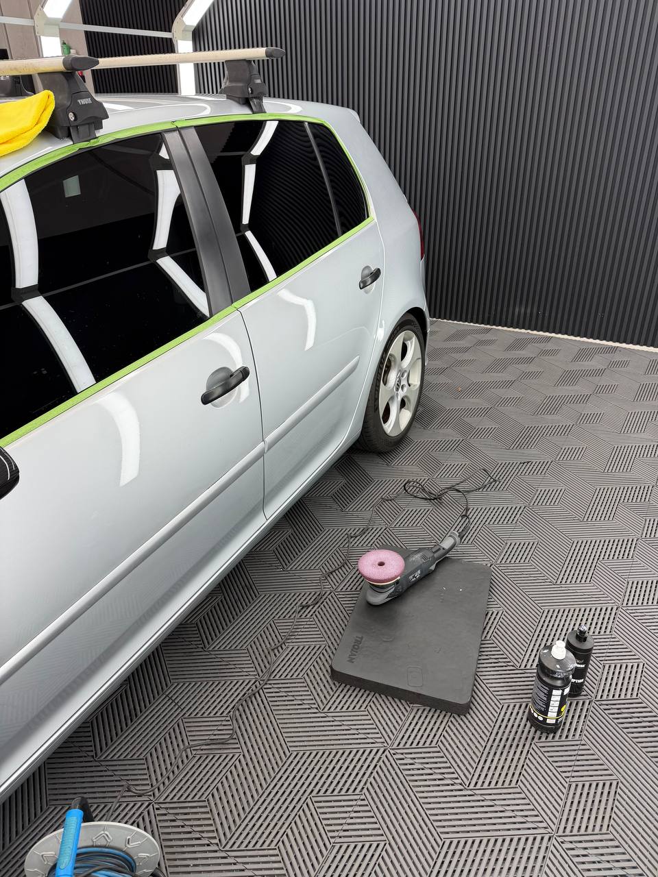 Machine paint correction in progress on a silver vehicle at Speca Detailing